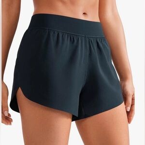 Navy CRZ YOGA Mid Waisted Dolphin Athletic Shorts for Women 4"